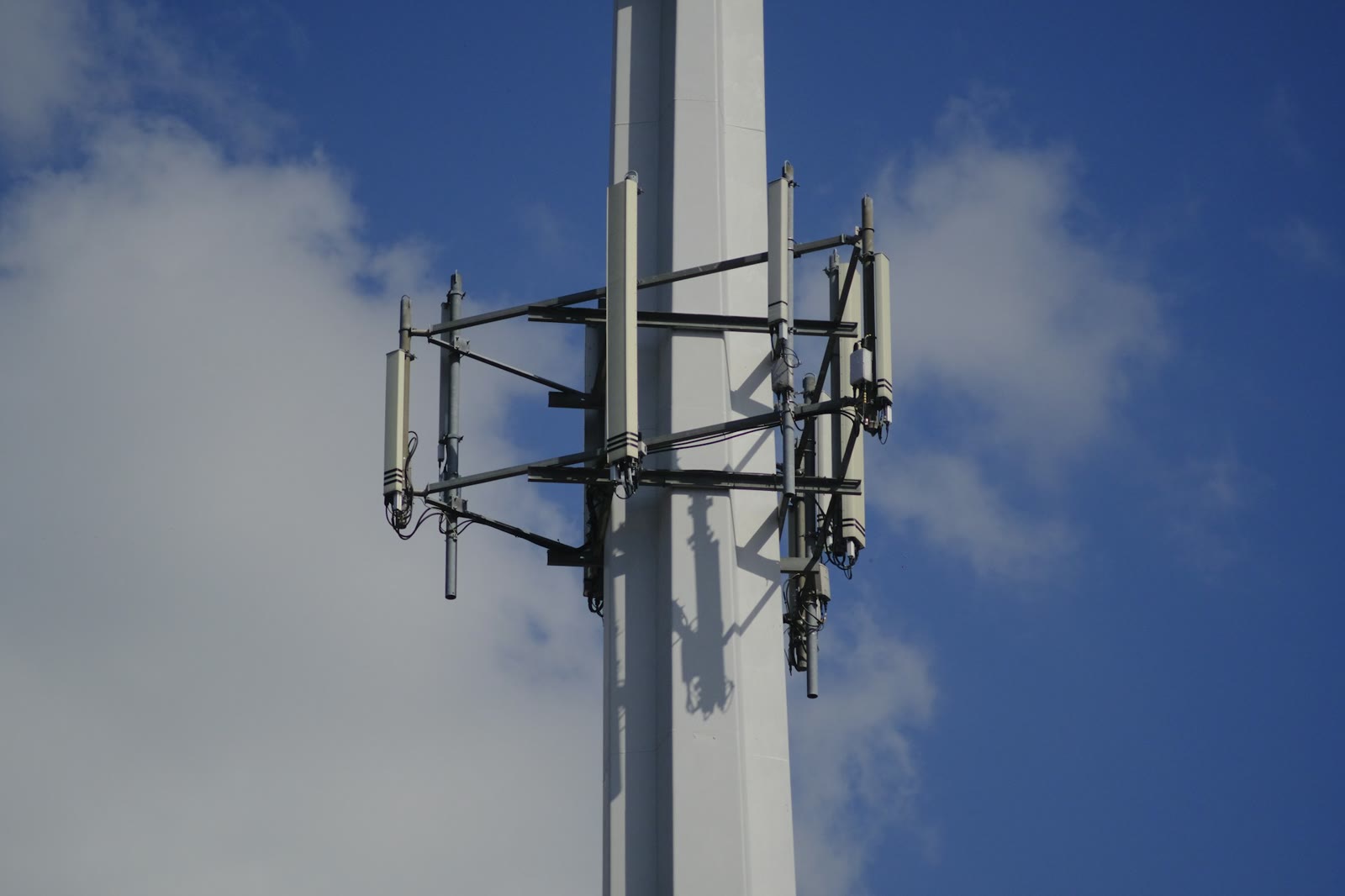 A mobile phone network tower against the sky